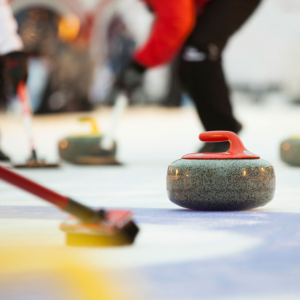 Curling teams compete on two separate sheets of ice.
