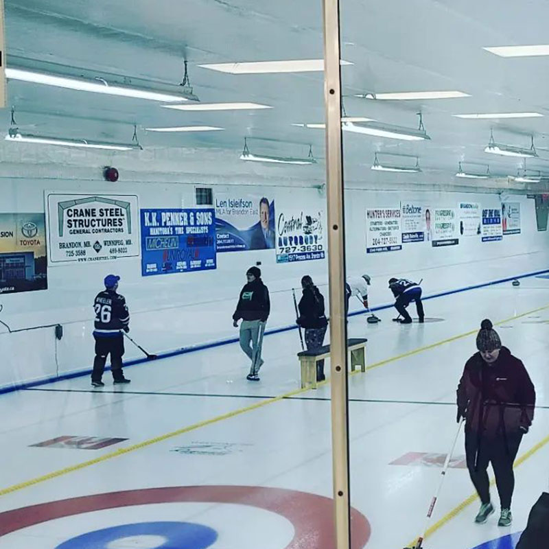 Advertising displayed along the walls of the Riverview Curling Club