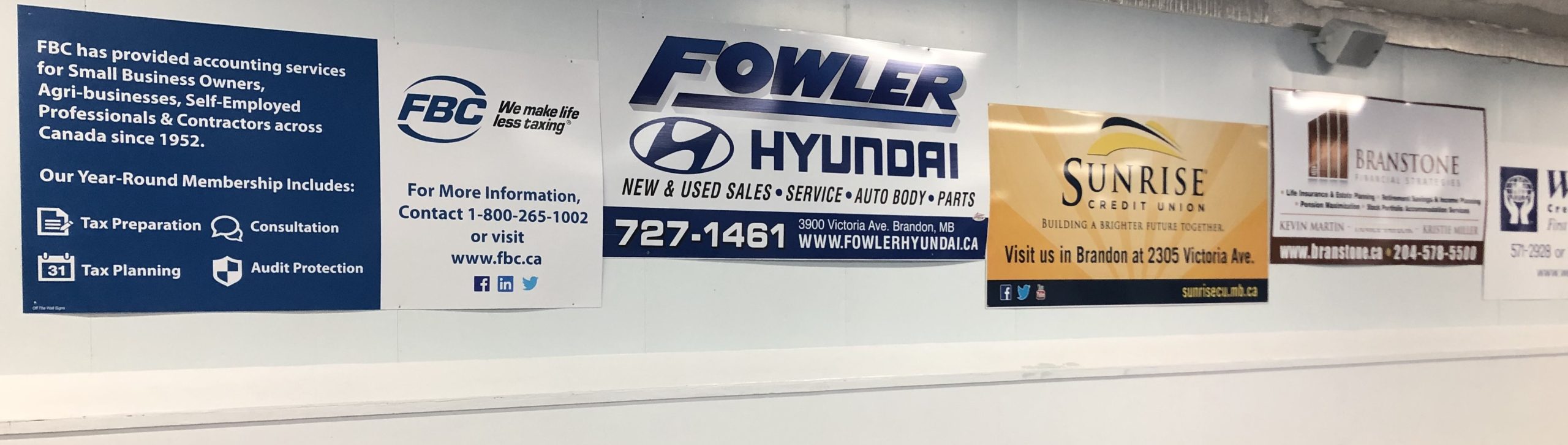 Advertising displayed along the walls of the Riverview Curling Club